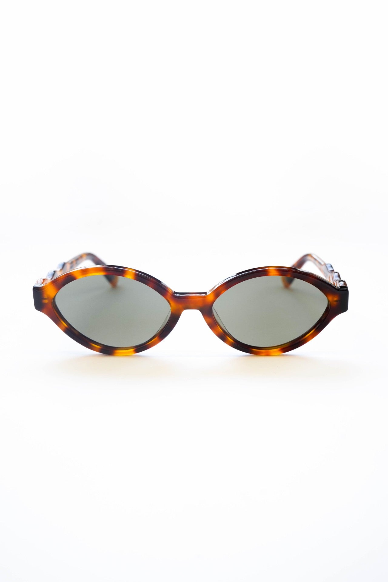 slim oval sunglasses with wavy temple in tort